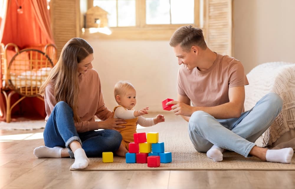 Parents playing with toddler
