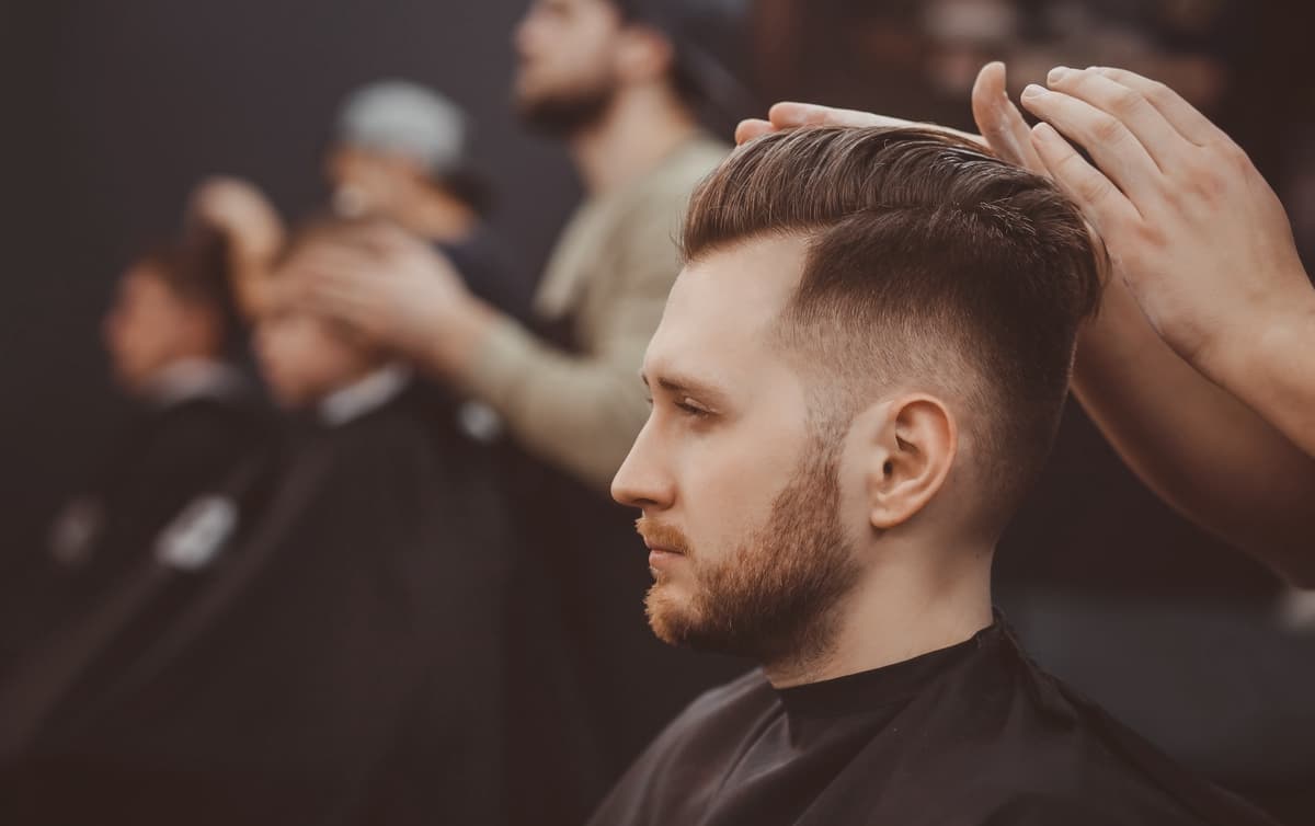 Man getting his hair styled in a hair salon