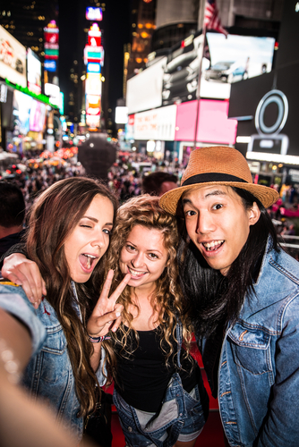 Friends in Times Square at night