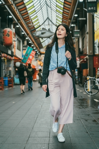 Woman walking through market